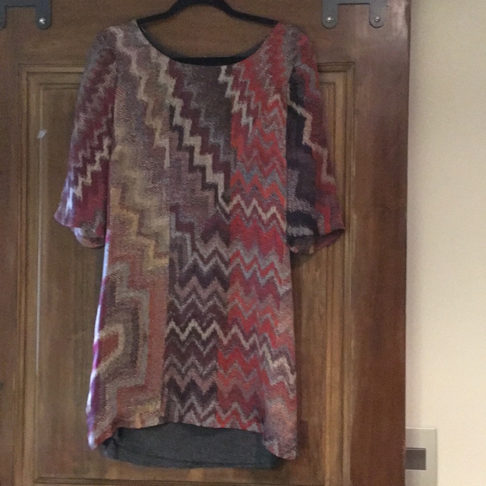 Single 100% silk with jersey back dress. Size M.